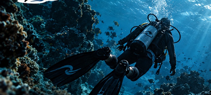 A scuba diver exploring a sunlit reef